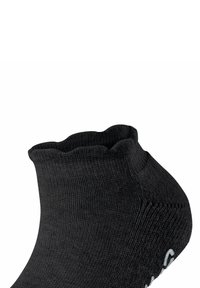 Zwarte enkel sok met een geribbelde structuur, golvende bovenrand en zilveren logo-accent aan de zijkant. Gemaakt van rekbaar, comfortabel materiaal.