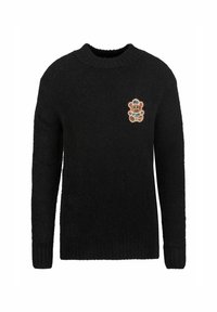 Zwart gebreid sweater met lange mouwen en een ronde hals; heeft een kleurrijke teddybeerpatch op de linkerborst.