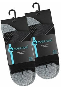 Chaussettes de sport noires et grises, en paquet avec une carte. Comprennent un renforcement au niveau des orteils et du talon, avec un mélange de matériaux texturés et lisses.