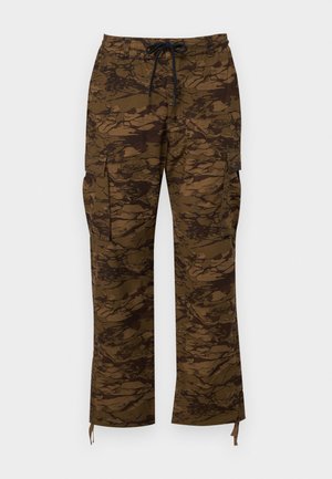 Brown cargo pants with a textured camouflage pattern, featuring an elastic waistband, drawstring, and side pockets. Casual fit, straight leg.