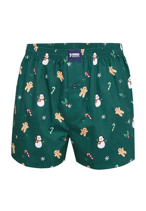Groene boxers met een elastische tailleband, bedrukt met peperkoekmannetjes, sneeuwpoppen, zuurstokken en sneeuwvlokken in een herhalend patroon.