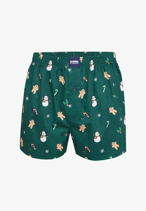 Groene boxers met een elastische tailleband, bedrukt met peperkoekmannetjes, sneeuwpoppen, zuurstokken en sneeuwvlokken in een herhalend patroon.