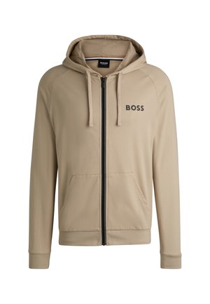 Beige zip-up hoodie met een zwart logo op de borst, voorzakken en een verstelbare capuchon met trekkoord. Glad stof en geribde manchetten.