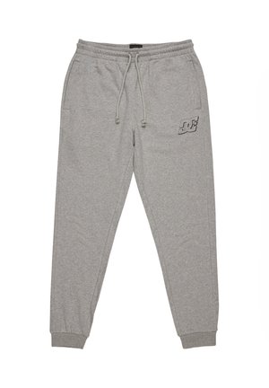 Graue Sweatpants aus Baumwollmischung. Sie verfügen über einen elastischen Taillenbund mit Kordelzug, schmal zulaufende Säume und ein kleines Logo am linken Oberschenkel.