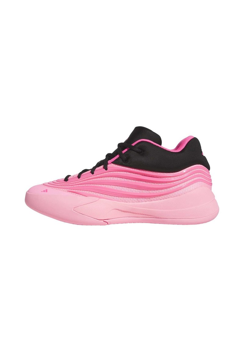 Pink athletic shoe featuring a textured upper, smooth rubber sole, black accents, and a wavy design. Lace-up closure with rounded toe.