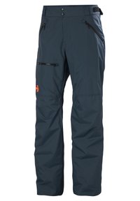 Waterdichte skibroek in donkerblauw, met een zachte textuur, ritszakken, een verstelbare tailleband en een oranje logo-accent.