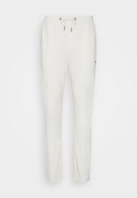 Witte joggingsbroek van zacht materiaal, met een elastische tailleband met trekkoord, zijzakken, en een subtiele logodetail op de dij.