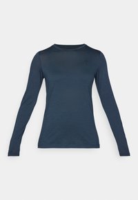 Long-sleeve shirt in dark navy, made of lightweight fabric. Features a round neckline and a small emblem on the chest. Smooth texture.