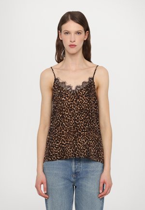 Leopardenmuster-Camisole mit verstellbaren Spaghettiträgern, zartem Spitzensaum am Halsausschnitt und weichem Stoff. Getragen mit hellblauen Jeans.