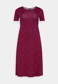 Robe courte à manches courtes rouge et marine avec une coupe ajustée, présentant un motif abstrait éparpillé et un col rond. Texture de tissu lisse.