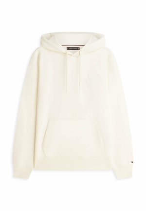 Hoodie in Cremefarbe mit vorderer Kängurutasche, Kapuze mit Kordelzug, dezent gesticktem Logo auf der Brust und kleinem Flaggen-Detail am Ärmelbündchen.