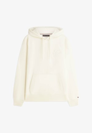 Kremowa bluza z kapturem z kangurzą kieszenią z przodu, kapturem ze sznurkiem, subtelnym haftowanym logo na piersi i małym detalem w postaci flagi na mankiecie rękawa.