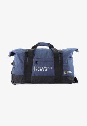 Blue duffel bag with black accents, adjustable straps, and a prominent logo reading "THIS BAG HAS PURPOSE." Features a durable fabric texture.