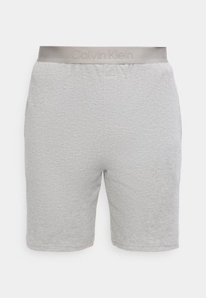 Világosszürke gofré kötésű rövidnadrág elasztikus derékpánttal, elöl finom Calvin Klein logóval.