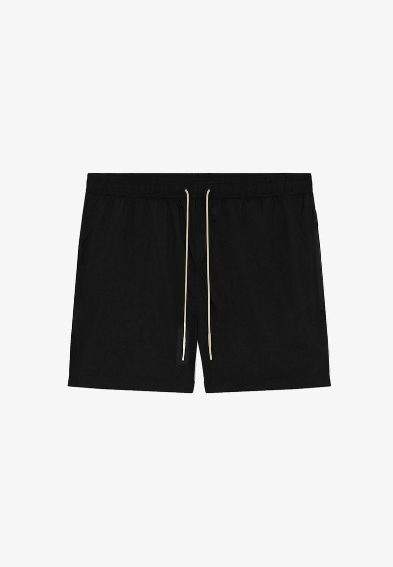 Shorts de bain noirs en tissu léger, dotés d'une taille à cordon crème, de poches latérales et d'une coupe décontractée.
