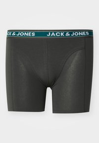 Boxer elastic grigio scuro con un cinturino turchese che presenta il testo "JACK & JONES" in bianco. Realizzati in materiale elasticizzato, con una consistenza liscia.