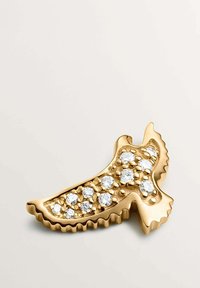 Clip de pelo metálico en tono dorado con forma de pájaro, que presenta una superficie texturizada y brillantes claros incrustados en un diseño ondulado.