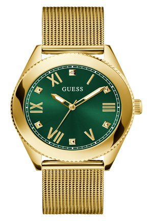 Montre-bracelet en maillage doré avec un cadran vert, dotée de chiffres romains, d'une lunette texturée et de petits accents en diamant aux positions 12 et 6 heures.