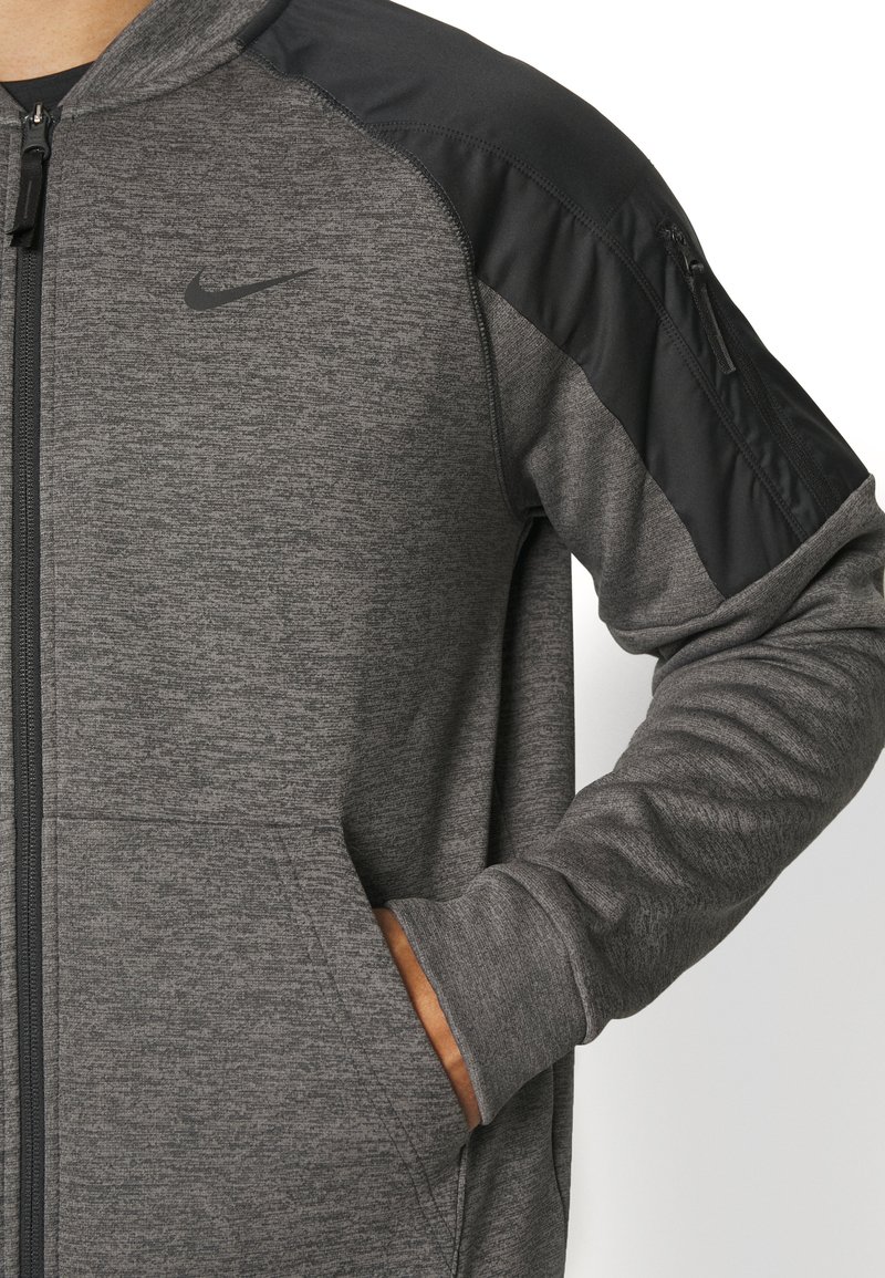Nike Performance THERMA NOVELTY BOMBER - Veste de survêtement - charcoal  heather black/black/noir - ZALANDO.FR