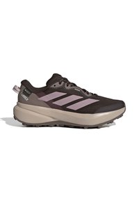 Black and gray Adidas Terrex trail running shoe with thick beige sole and three gray stripes on the side.