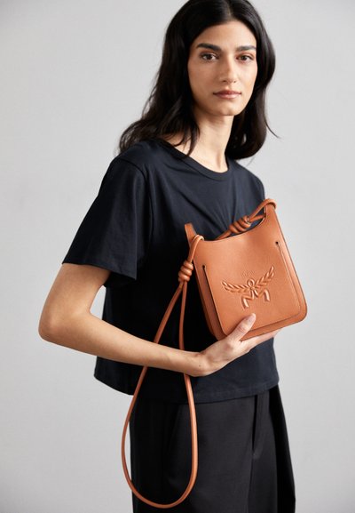 MCM LAURETOS HOBO  - Cross body bag - cognac