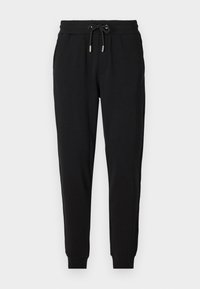 Zwarte joggingsbroek met een elastische tailleband, verstelbare koord, zijzakken en tapered pijpen. Gemaakt van zachte, rekbare stof.