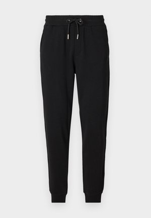 Black sweatpants with an elastic waistband, adjustable drawstring, side pockets, and tapered legs. Made from soft, stretchy fabric.
