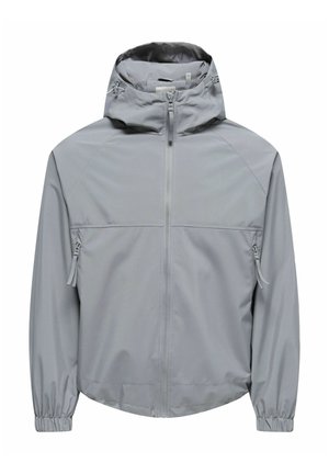 Lichtgrijze jas met capuchon, voorzien van een ritssluiting aan de voorkant, ritssluitingen aan de zijkanten en elastische manchetten, ontworpen voor buitengebruik.