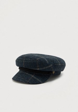Navy blue tweed flat cap with beige windowpane pattern and black braided band above the brim, displayed on a plain background.