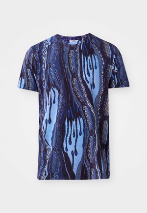 Cotton T-shirt featuring a blue and navy abstract pattern with wavy lines, short sleeves, and a round neckline. Soft texture.