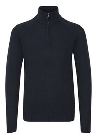 Marineblaue Strickjacke mit einem Reißverschlusskragen, die über Bündchen und Saum in Rippenstruktur sowie ein strukturiertes Muster im Rumpf verfügt.
