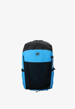 Zaino blu e nero con tasca frontale in rete, maniglia superiore e logo mammut centrato sul pannello frontale superiore.