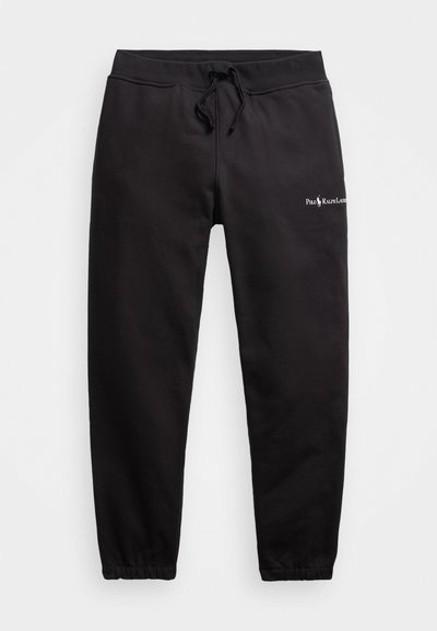 Schwarze Sweatpants aus Baumwolle mit einem elastischen Bund und Kordelzug, tapered Bein Design und einem kleinen Logo auf der Vorderseite.