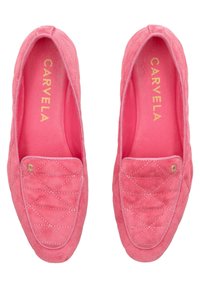 Pink suede slip-on shoes with quilted pattern, rounded toe, and contrasting stitching. Gold hardware accent on the front.