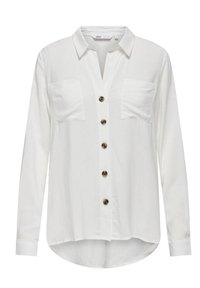 Chemise blanche à manches longues avec boutonnage à l'avant, deux poches sur la poitrine et un ourlet arrondi. Présente des détails en bouton marron et un col.