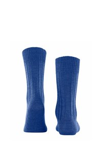 Chaussettes en coton bleu avec une texture côtelée, dotées d'une bordure renforcée et d'une couture lisse au niveau des orteils. Le design est simple et droit.
