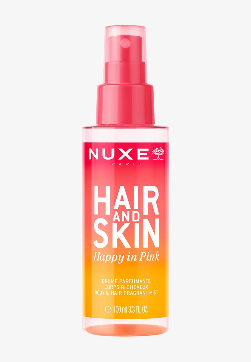 Flacon de spray parfumé pour corps et cheveux Nuxe Hair and Skin Happy in Pink, dégradé rose et orange, 100 ml.