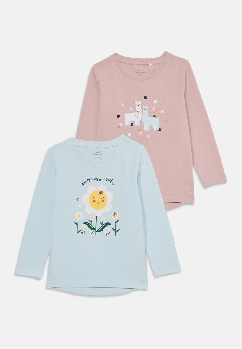 Divas garām piedurknēm: viena rozā ar lamas attēliem, otra gaiši zila ar smaidīgu ziedu. Abas izgatavotas no mīkstas kokvilnas.