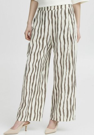 Wide-leg trousers made of lightweight fabric, featuring vertical brown stripes on a cream background. Worn with beige heels.