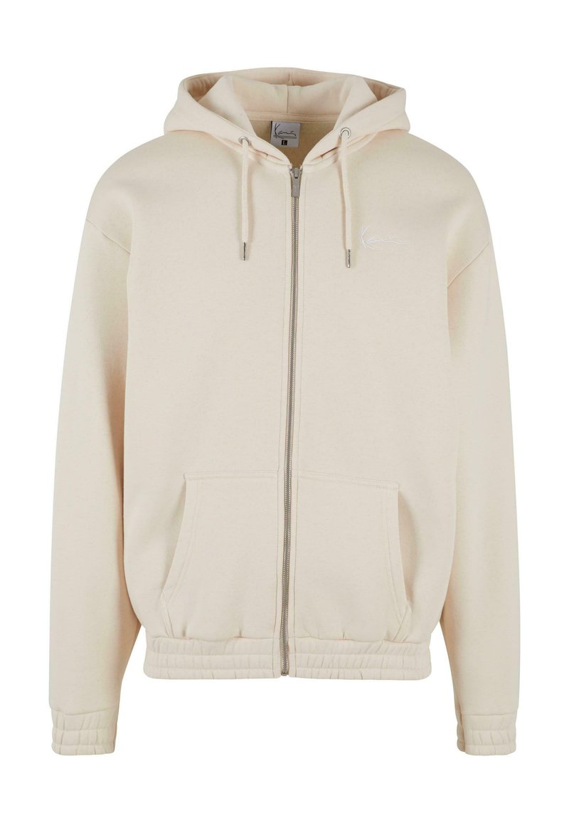 Karl Kani Sweater met rits zandkleur Karl Kani Sweater met rits zandkleur