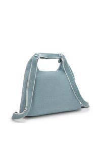 Teal fabric bag with a textured surface, angular shape, and a rounded, cut-out handle. Features a contrasting white trim along the strap.