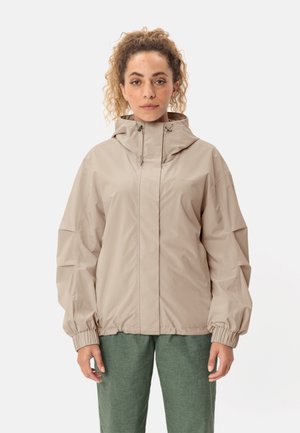 Beige waterproof jacket with a hood, elastic cuffs, and a relaxed fit design. Smooth texture and minimalistic style.