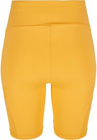 Geel hoge taille shorts van glad stretchmateriaal. Heeft een slim fit met zijzakken en een naadloos ontwerp.