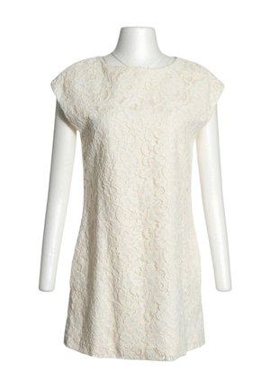 Cream-colored sleeveless dress with floral lace pattern displayed on a headless white mannequin against white background.