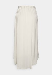 Lichtbeige, middellange rok met een elastieken tailleband. Gemaakt van zacht, vloeiend stof, met een gladde textuur en een lichte A-lijn vorm.