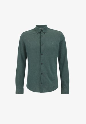 Donkergroen button-up shirt in een gestructureerde stof. Kenmerkend zijn de kraag, lange mouwen en zes zwarte knopen aan de voorkant. Geborduurd logo op de borst.