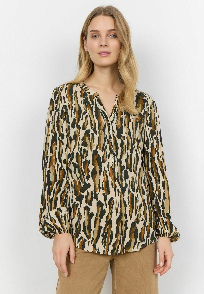 Long-sleeve blouse in beige with a bold abstract print in earthy tones. Features a V-neckline and gathered cuffs. Soft, smooth texture.