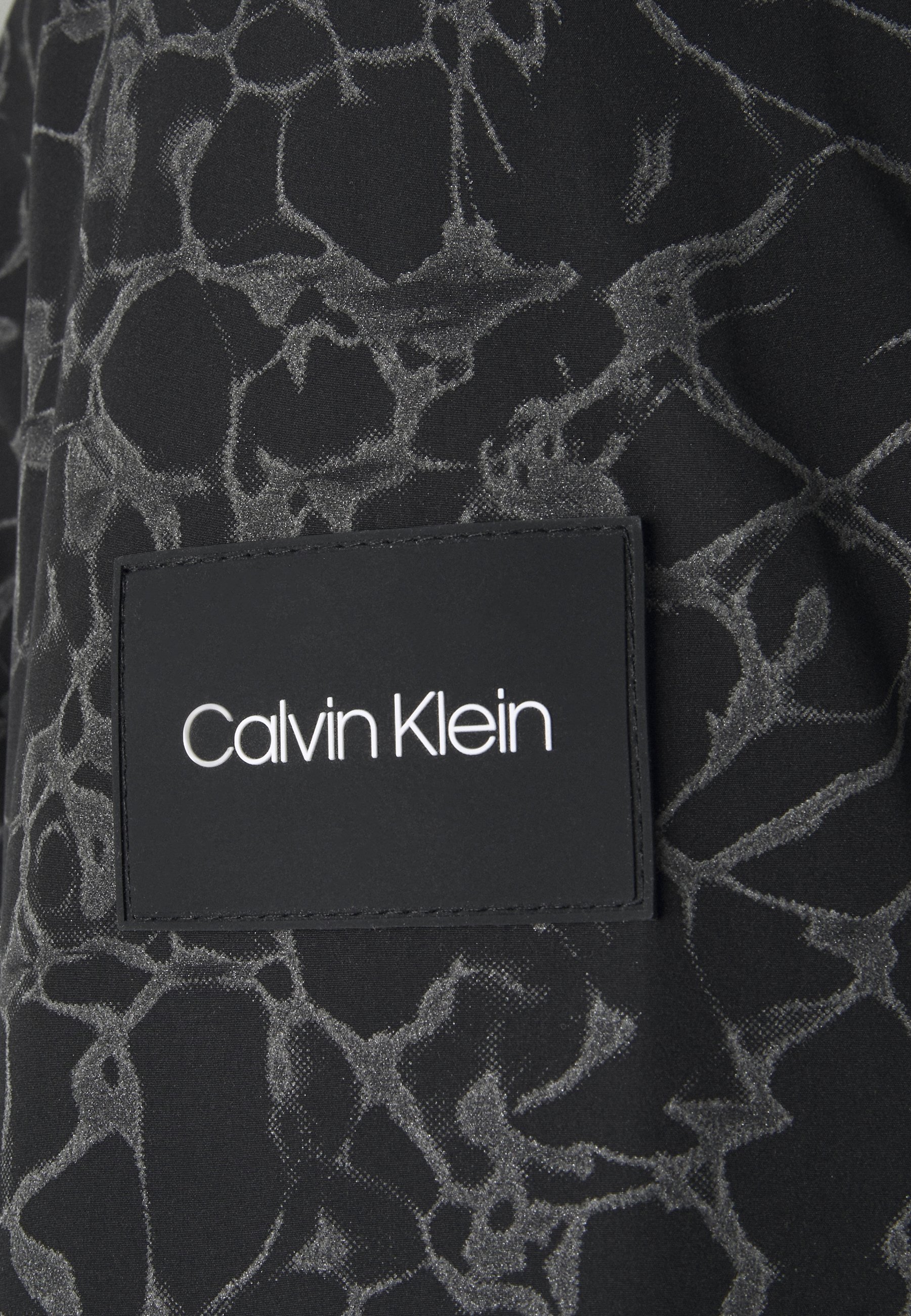 calvin klein reflective bomber jacket