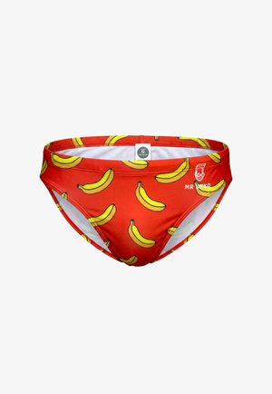 Red swim briefs with a repeating yellow banana pattern and a white Mr Ukko logo on the right front side.