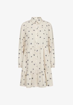 Rochie cu nasturi din țesătură crem cu model texturat; prezintă accente florale bleu marin, mâneci lungi și un design cu fuste stratificate.